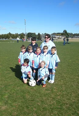 Junior soccer team in blue on our committee page
