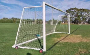 White soccer goalpost on grass