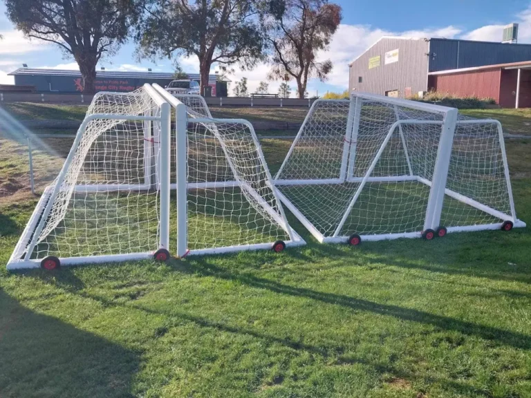white junior soccer goalposts on grass